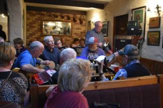 Doolin locals sing Irish songs at Gus O'Connor's Pub on a weekday afternoon.
